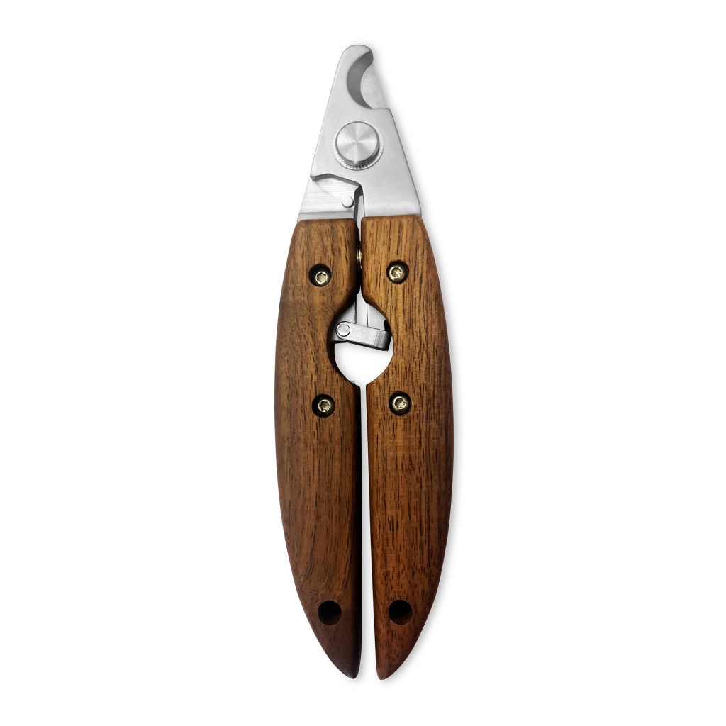 Wooden nail clippers sitting on a white background.