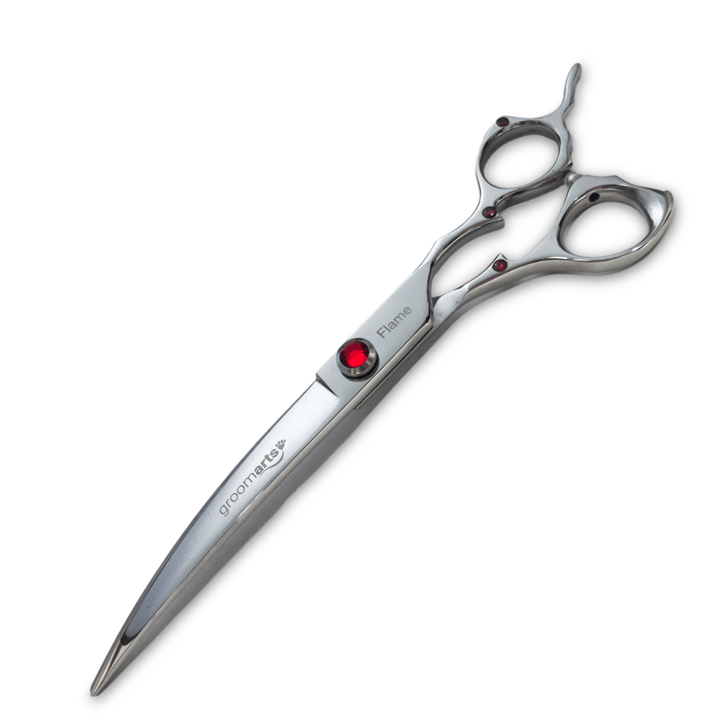 Silver curved scissor with a red gem at the centre.