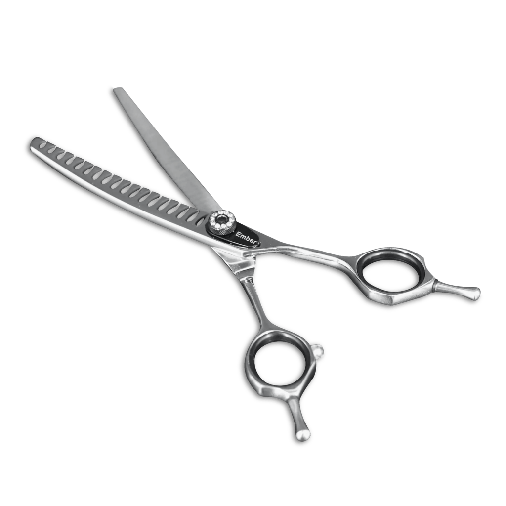 Curved Silver Scissor sitting on a transparent background away from camera.